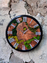 Close-up of the Roman numeral clock face on olive wood with lush preserved moss