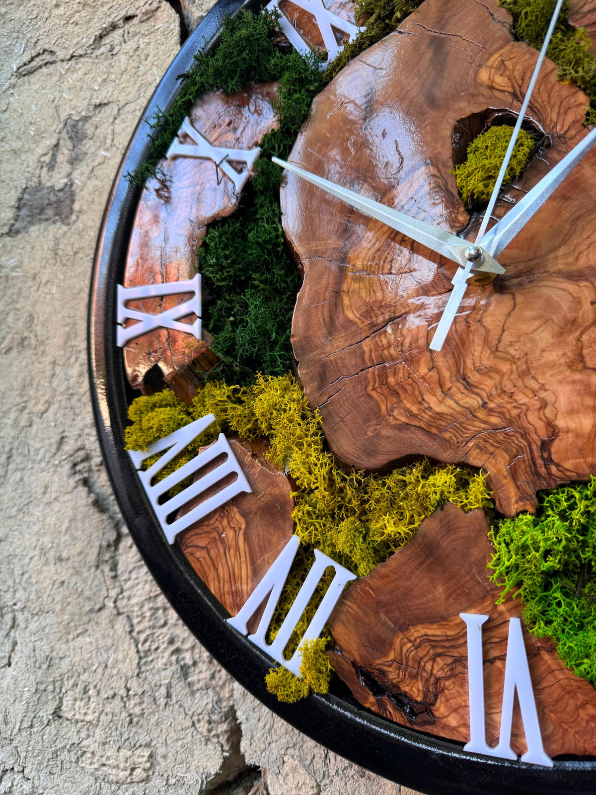 Preserved moss wall clock above a couch in a cosy biophilic bedroom