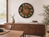 Large moss wall clock on a white wall in a minimalist Scandinavian room