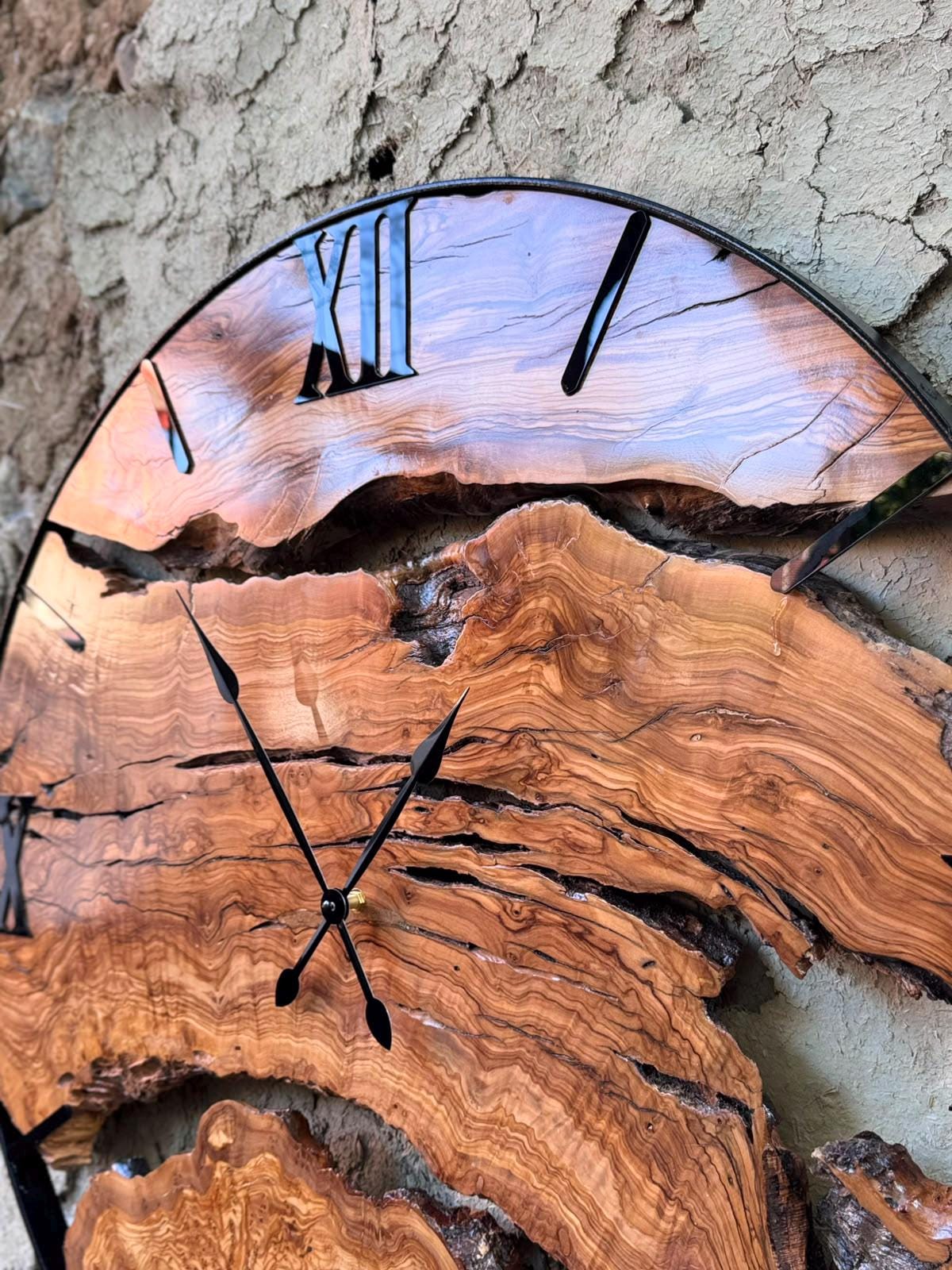 Close-up of live edge grain detail on a rustic olive wood clock