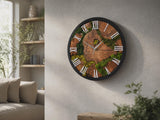Round preserved moss and olive wood wall clock with black frame, white Roman numerals and silver hands