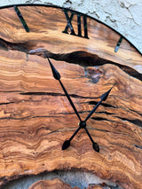 Size comparison chart showing the available diameters of the live edge olive wood wall clock