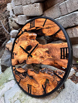 Back of the oversized olive wood wall clock showing mounting hardware and clock mechanism