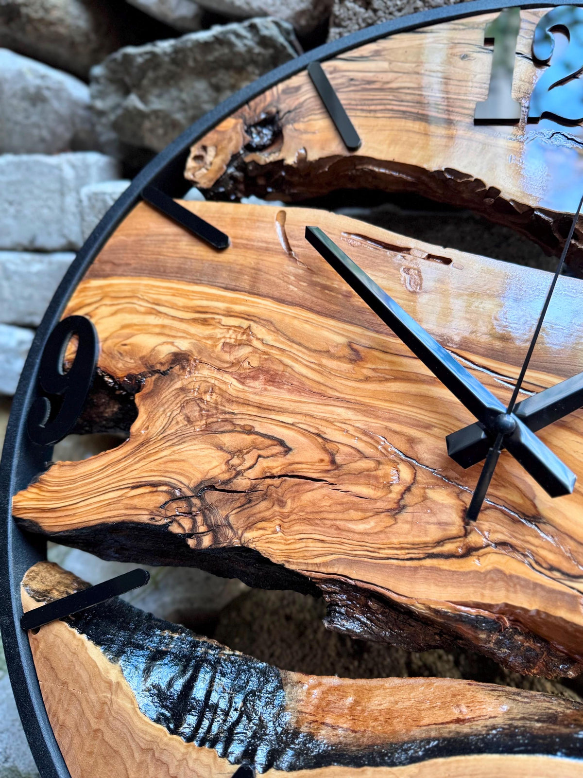 Oversized rustic wooden clock close-up showing the live edge natural slab and handmade craftsmanship