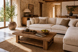 Low cedar table beside a linen sofa with books and a tray