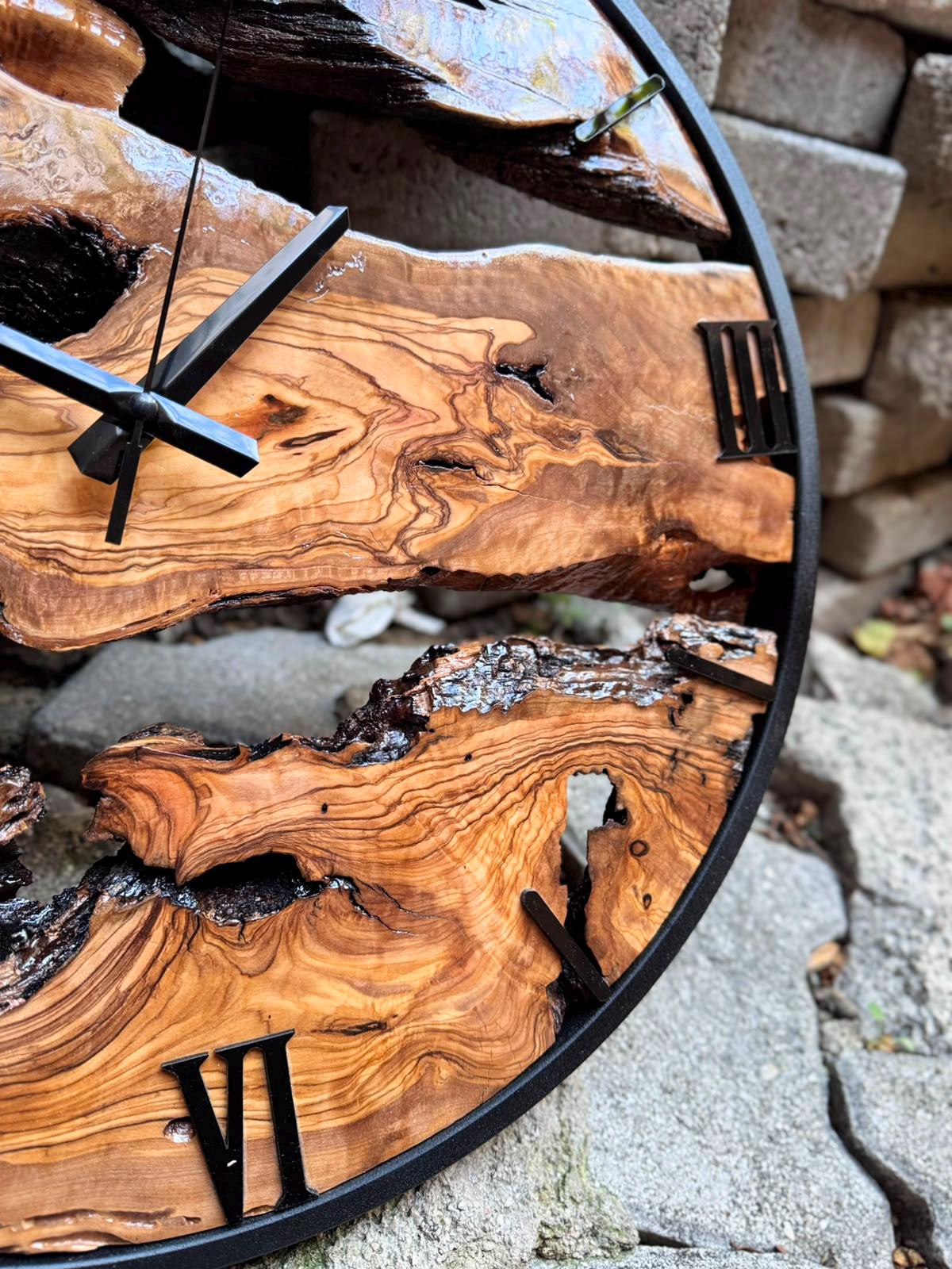 Large wood clock mounted in a modern farmhouse dining room, warm olive tones against neutral decor
