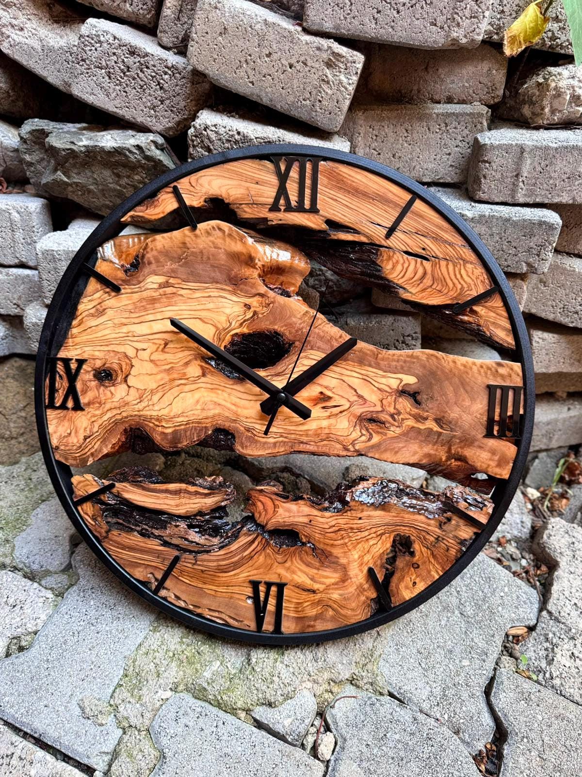 Oversized rustic wall clock presented as a housewarming gift with olive wood grain detail visible