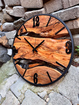 Size scale comparison showing the oversized natural wood timepiece next to common objects