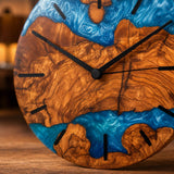 Detail of the olive wood live edge bordering the blue resin surface