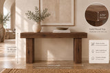 Reclaimed solid wood console table in a rustic farmhouse entryway, with natural grain and chunky legs