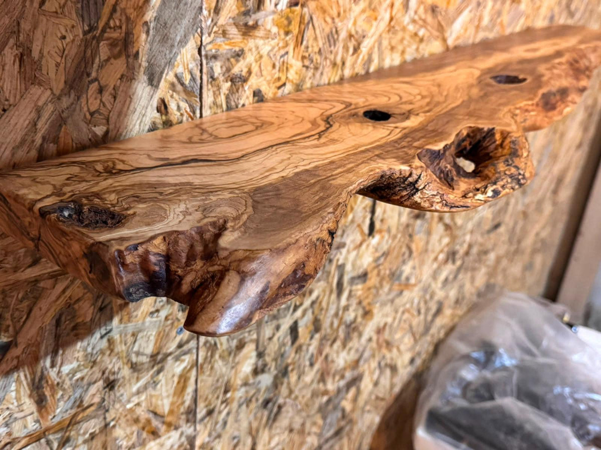 Olive wood floating shelf styled with ceramics