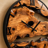 Detail of the clock hand hardware against the natural live edge rustic wood background