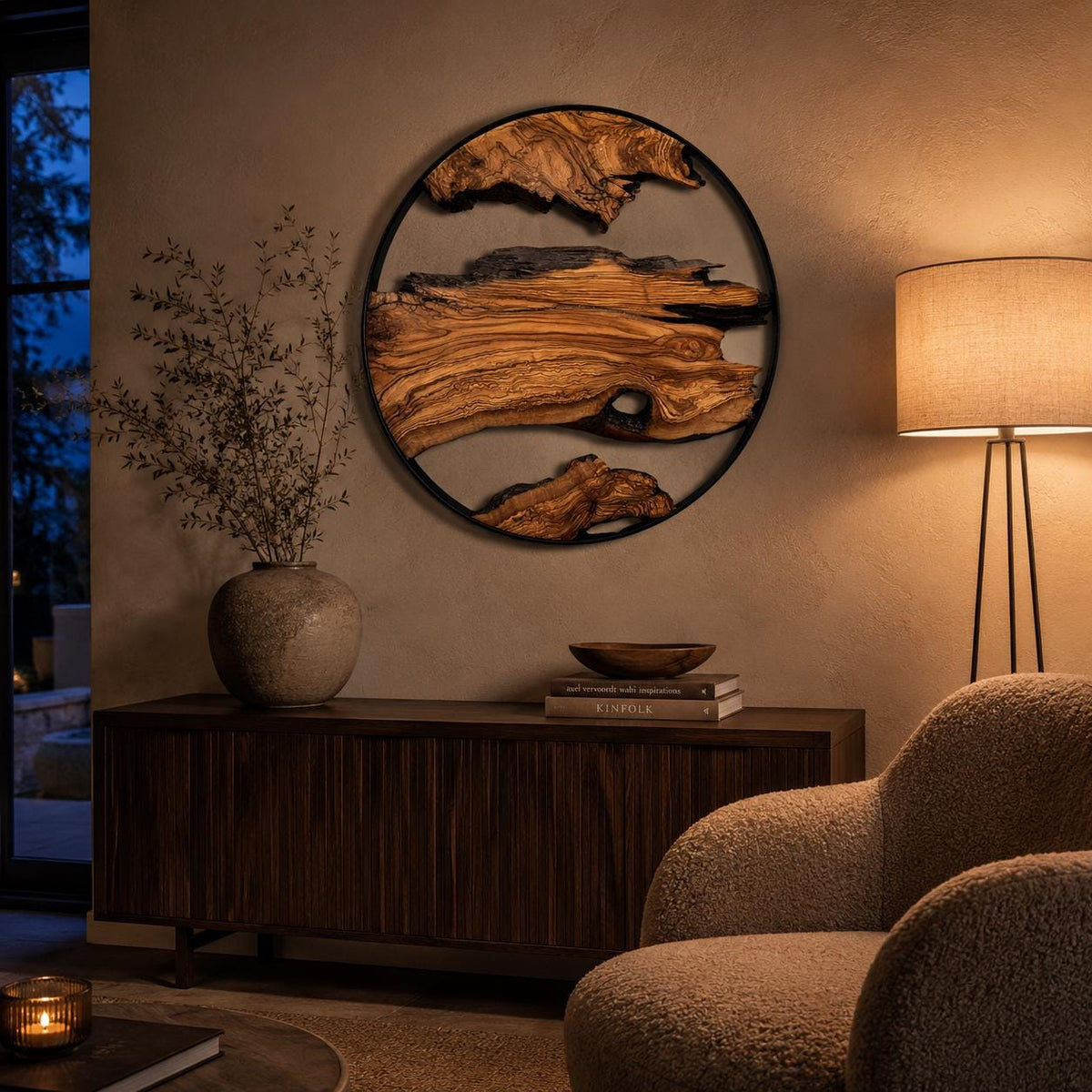 Round wooden wall hanging against a white wall, showing the warm wood tones