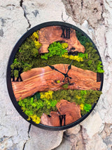 Corner vignette with the biophilic moss wall clock surrounded by trailing plants and a wood shelf