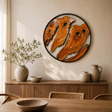 Round olive wood wall art with three live-edge slabs in a sleek circular black metal frame