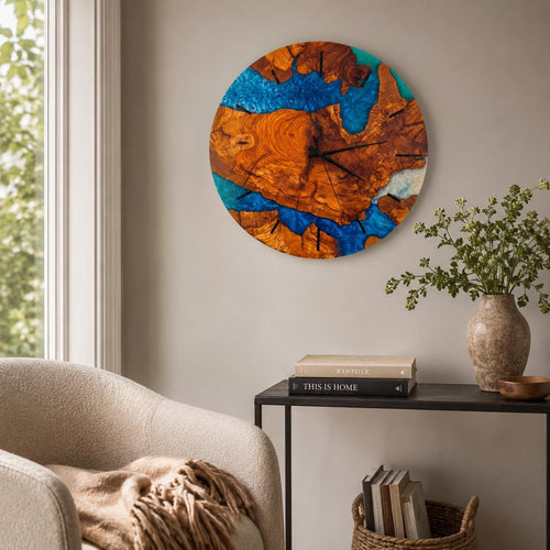 Blue resin wall clock in olive wood with an ocean wave pattern