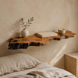 Olive wood floating shelf styled with decor