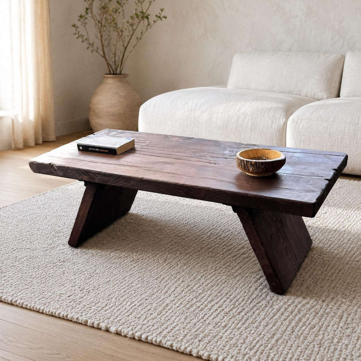 Front angled view of the dark brown solid cedar coffee table with a live edge top