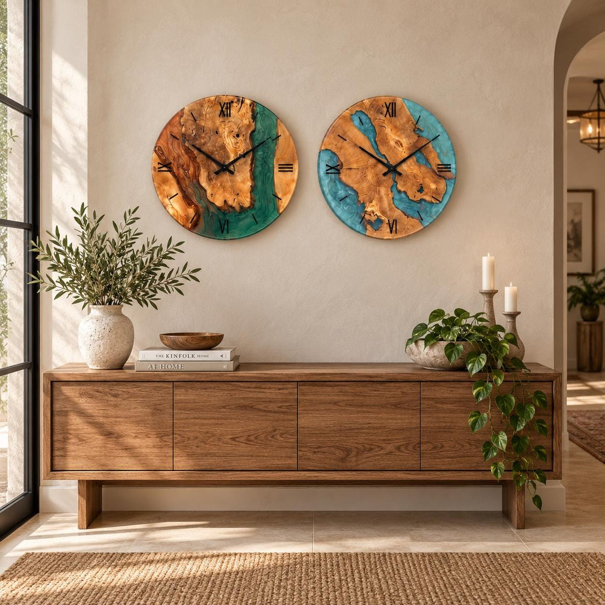 Green and turquoise epoxy olive wood wall clocks side by side above a rustic console