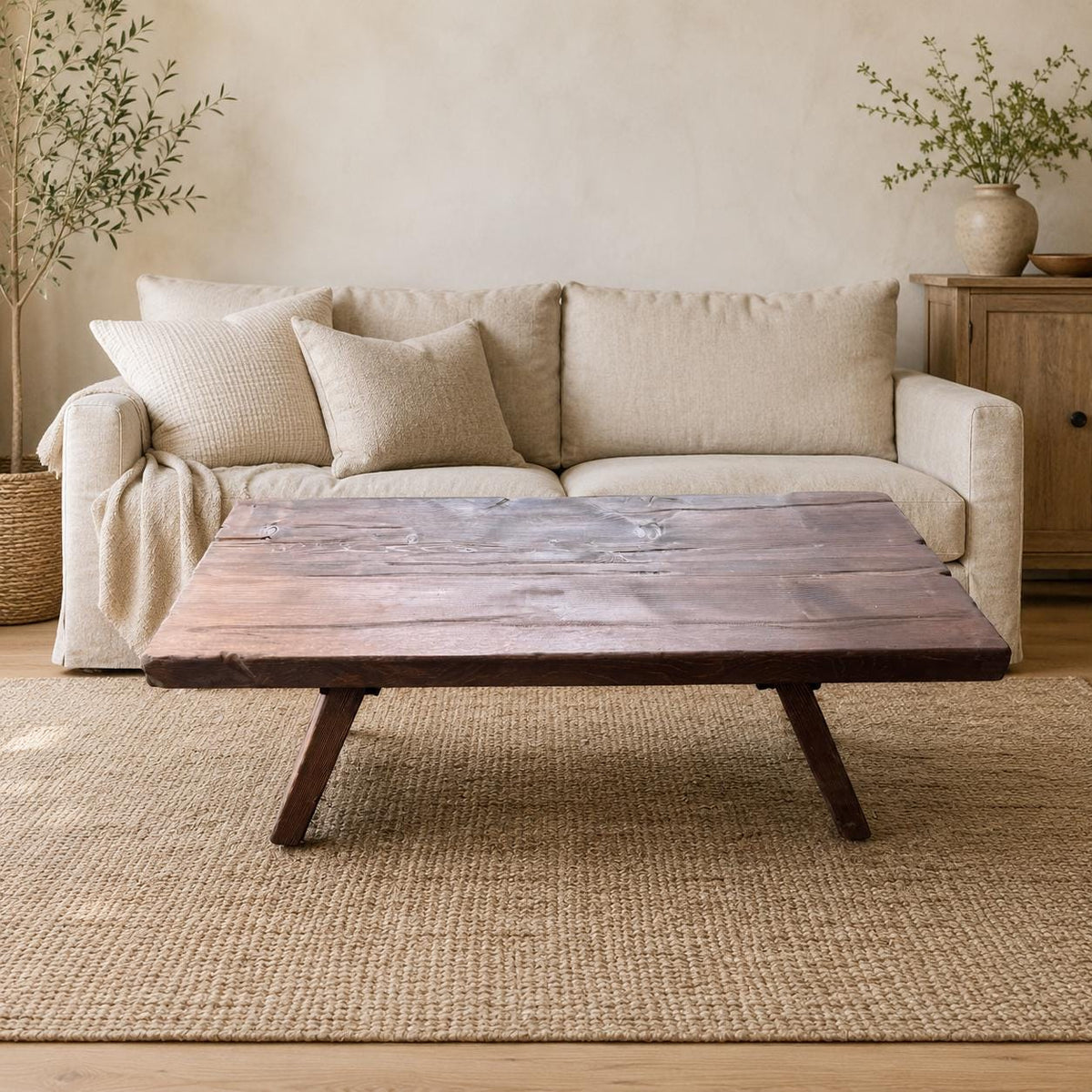 Straight front view of the rustic solid wood coffee table with a low profile and angled cedar legs