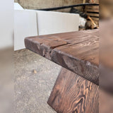 Close-up of natural cedar grain, plank seams, knots and the handcrafted live edge corner