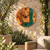 Emerald green epoxy clock on a Mediterranean stone garden wall