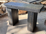 Handmade reclaimed wood console table shown full length with a slim top and straight solid wood legs