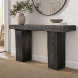 Reclaimed wood console table in a bright modern entryway with natural light and minimal decor