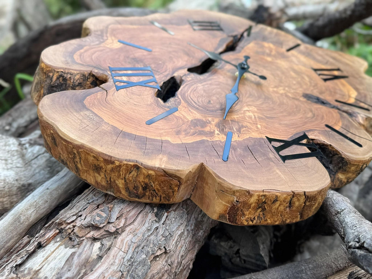 Olive wood slab clock showing the natural live edge silhouette