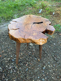 Olive tree coffee table with live edge slab top and tripod legs